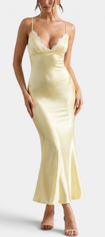Mahaute Srebrina long pale yellow satin evening dress with thin straps and delicate lace V-neckline on a model