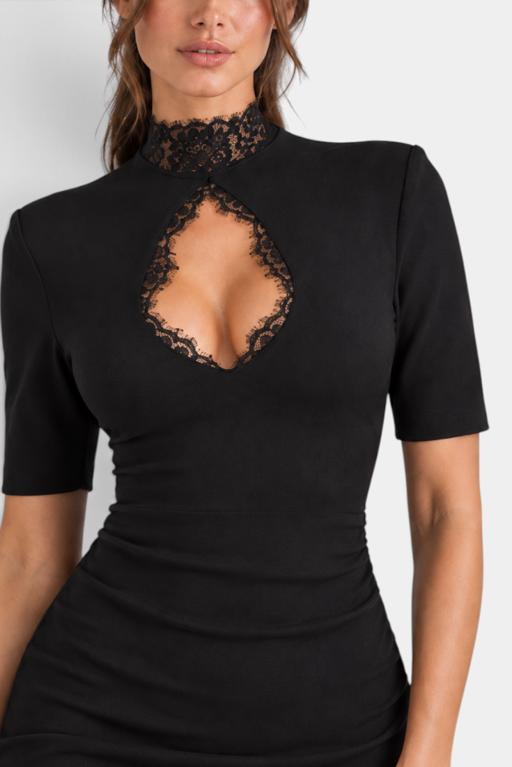 Mahaute Stanimira black fitted short dress featuring a high lace neckline and a bold chest cutout detail.