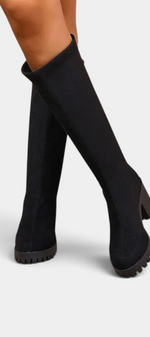 Mahaute Suny black knee-high boots with a structured shaft, block heel, and thick lug sole.