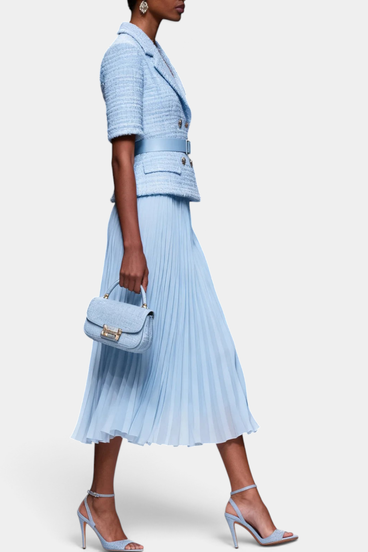 Mahaute light blue textured blazer with gold buttons and matching pleated midi skirt on a model