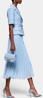 Mahaute light blue textured blazer with gold buttons and matching pleated midi skirt on a model