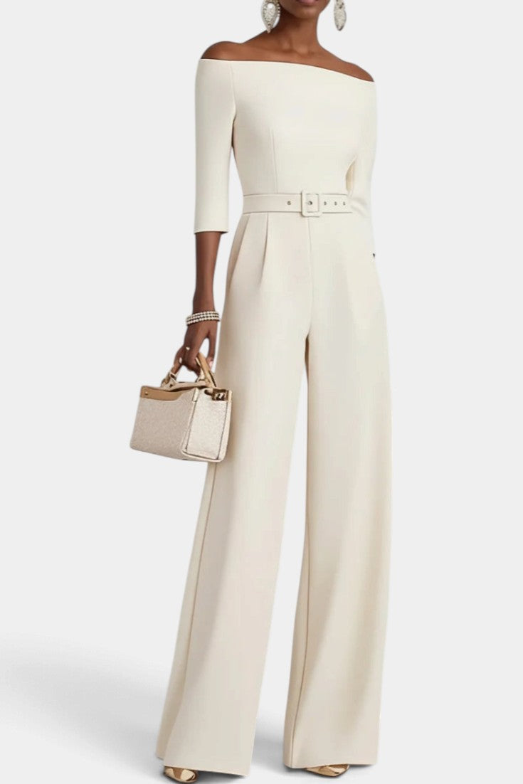 Mahaute Tisdale off-shoulder cream jumpsuit with wide legs, three-quarter sleeves, and a matching waist belt.