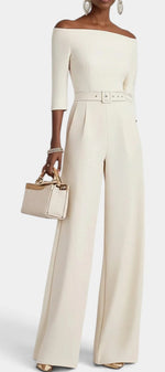 Mahaute Tisdale off-shoulder cream jumpsuit with wide legs, three-quarter sleeves, and a matching waist belt.
