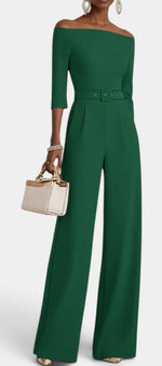 Mahaute Tisdale emerald green off-the-shoulder jumpsuit with a belted waist, three-quarter sleeves, and wide legs.