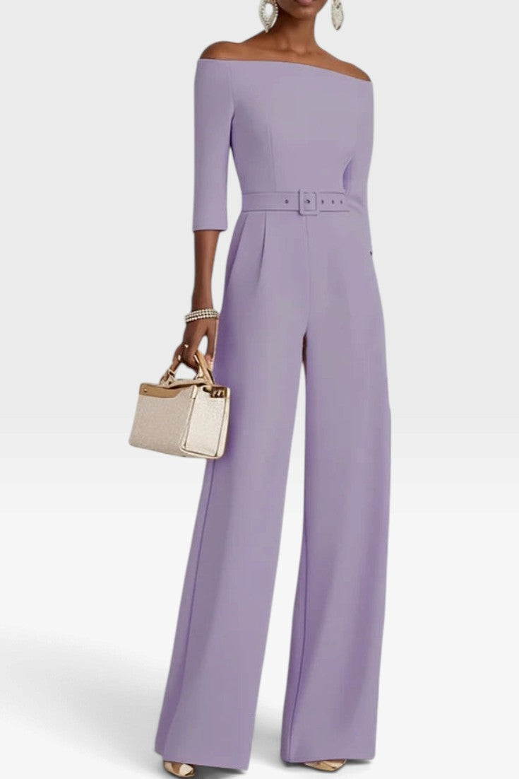 Mahaute Tisdale lavender off-the-shoulder jumpsuit with three-quarter sleeves, belted waist, and wide-leg trousers.