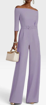 Mahaute Tisdale lavender off-the-shoulder jumpsuit with three-quarter sleeves, belted waist, and wide-leg trousers.