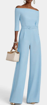 Mahaute Tisdale light blue off-shoulder jumpsuit with wide legs, three-quarter sleeves, and a matching waist belt.