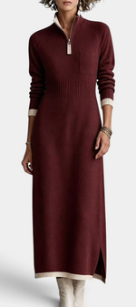 Mahaute Tryphena long burgundy knit dress with a zip-up collar, ribbed waist, chest pocket, and side slit.