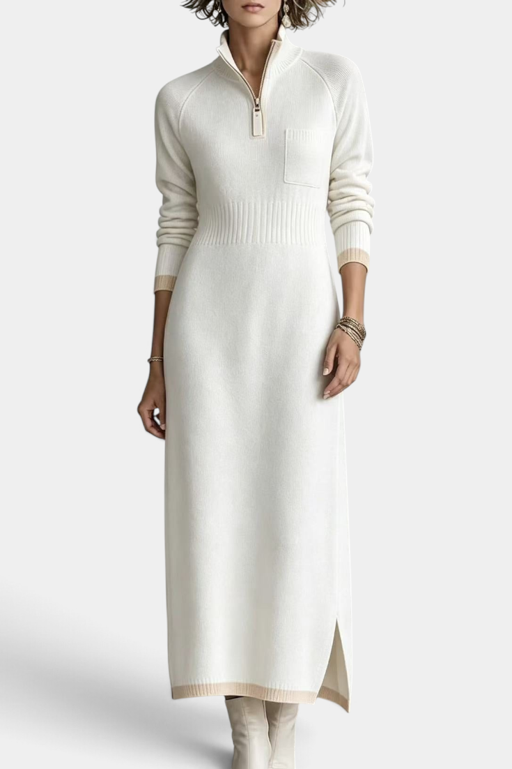 Mahaute Tryphena long cream knit dress with a zip-up mock neck, ribbed waist, chest pocket, and side slit detail.