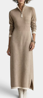 Mahaute Tryphena long beige knit dress with a zip-up mock neck, ribbed waist, chest pocket, and side slit detail.