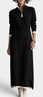 Mahaute Tryphena long black knit dress with a zip-up mock neck, ribbed waist, chest pocket, and contrast trim details.