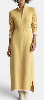 Mahaute Tryphena long yellow knit dress with a zip-up mock neck, ribbed waist, chest pocket, and side slit.