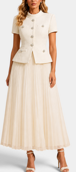 Mahaute Tsvetana cream ensemble featuring a structured short-sleeve jacket with jewel buttons and a pleated maxi skirt.
