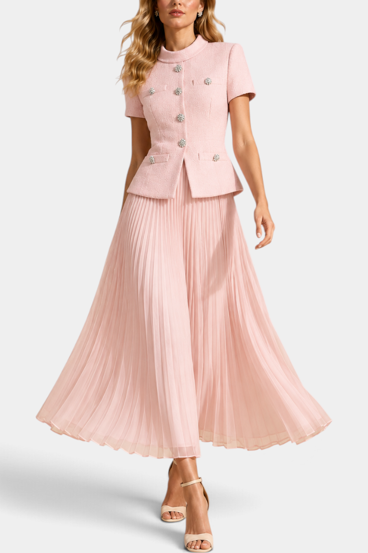 Mahaute Tsvetana pale pink structured short-sleeve jacket with jewel buttons and a matching long pleated skirt.