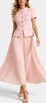 Mahaute Tsvetana pale pink structured short-sleeve jacket with jewel buttons and a matching long pleated skirt.