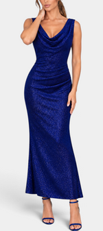Mahaute Tsvetelina long royal blue evening gown with cowl neck, draped waist, and shimmering fabric on a model