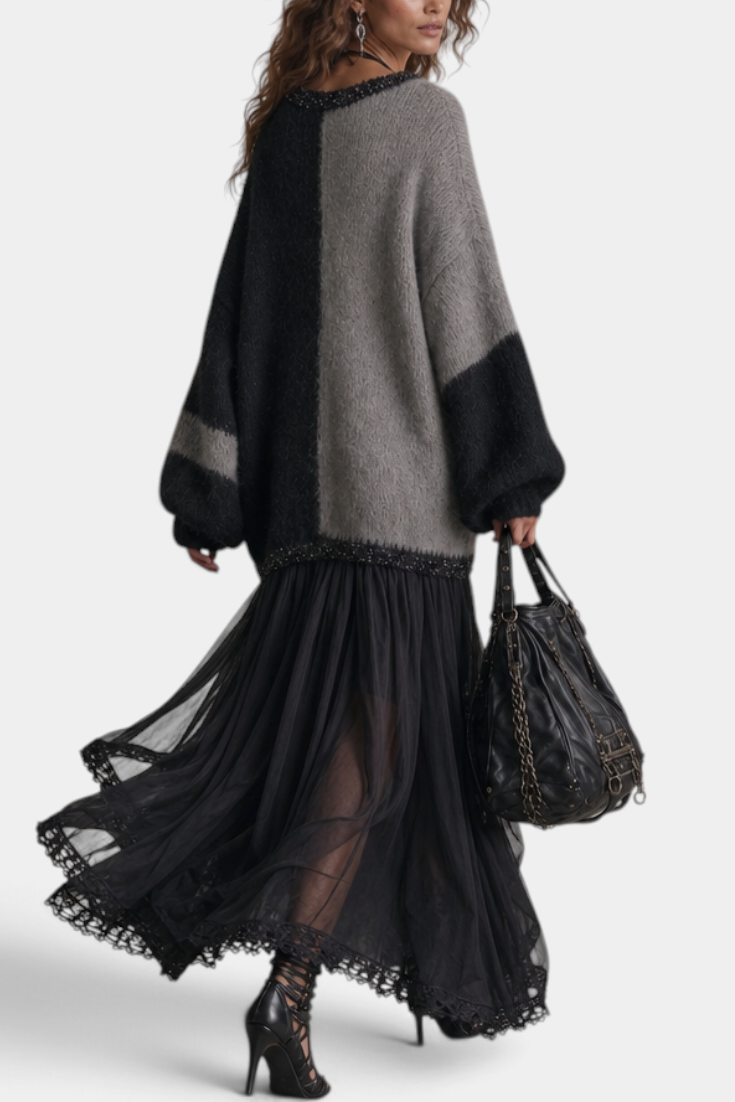 Mahaute long two-tone knit and voile dress with lace trim, V-neck, and flowing skirt worn by a model in motion.