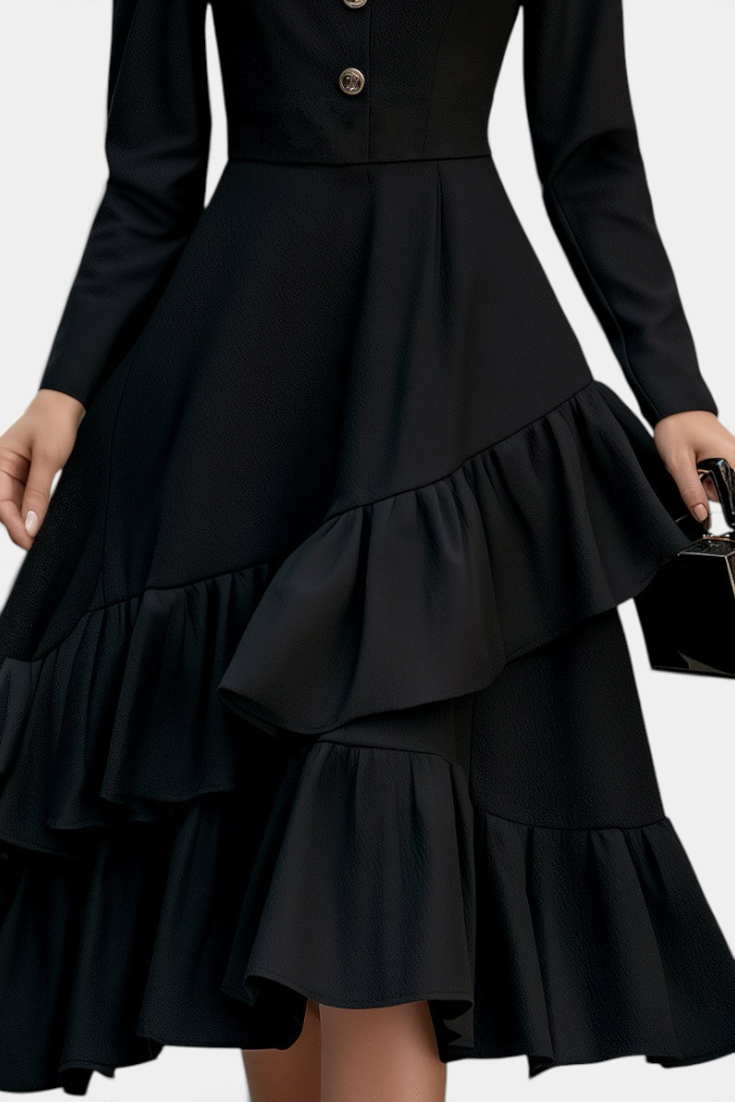 Mahaute Velislava black midi dress with long sleeves, cinched waist, jewel buttons, and asymmetrical ruffled skirt.