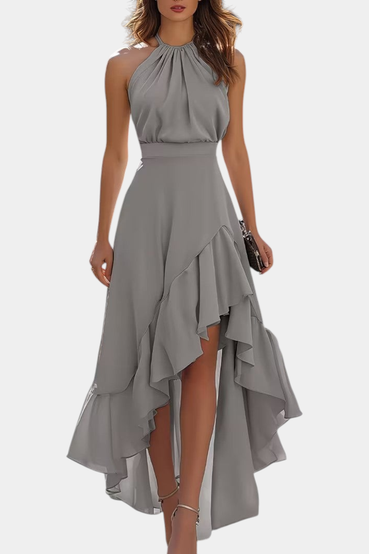 Mahaute Verity grey asymmetrical long dress with pleated halter neckline and flowing ruffles for formal occasions