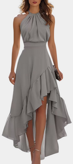 Mahaute Verity grey asymmetrical long dress with pleated halter neckline and flowing ruffles for formal occasions
