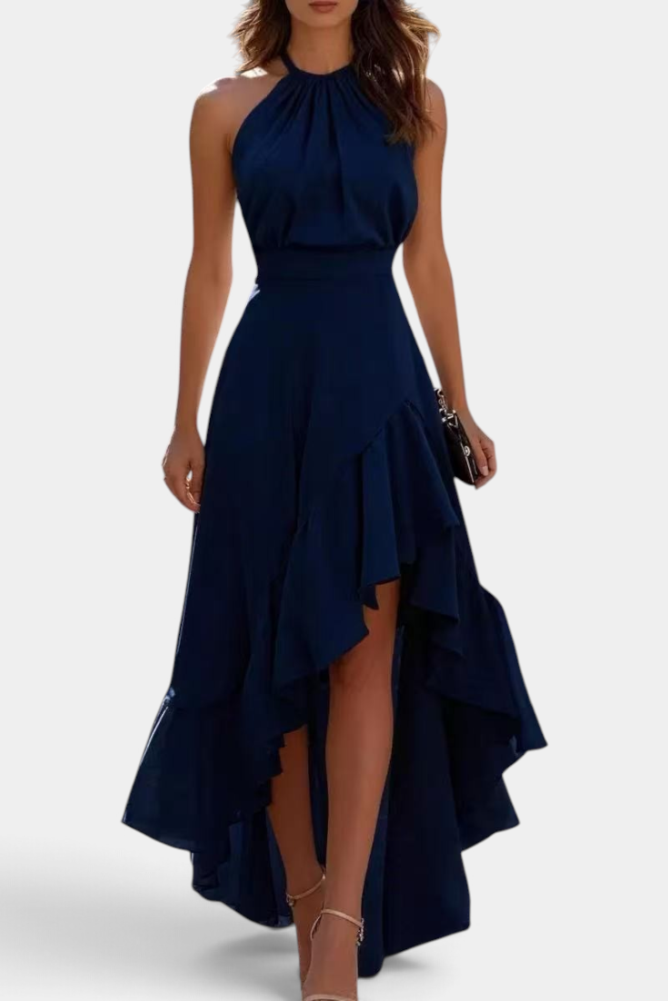 Mahaute Verity navy blue asymmetrical maxi dress with a pleated halter neckline and flowing ruffled skirt