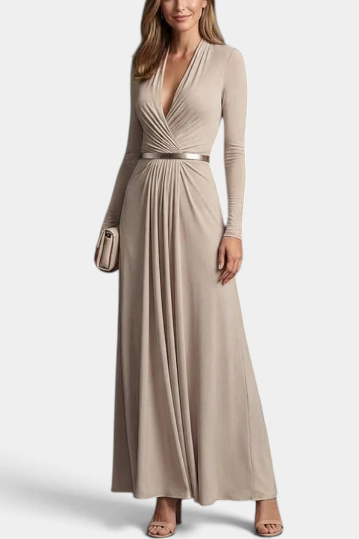 Mahaute Veselina long beige wrap dress with draped bodice, long sleeves, and metallic waist belt on a model