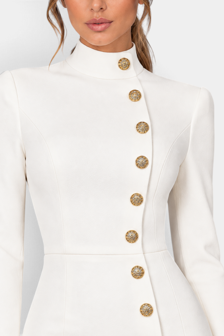 Mahaute Vihra cream midi dress featuring a structured high neck and asymmetrical gold embossed buttons