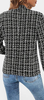 Back view of Mahaute Visenta short structured tweed jacket in black and white with a shirt collar