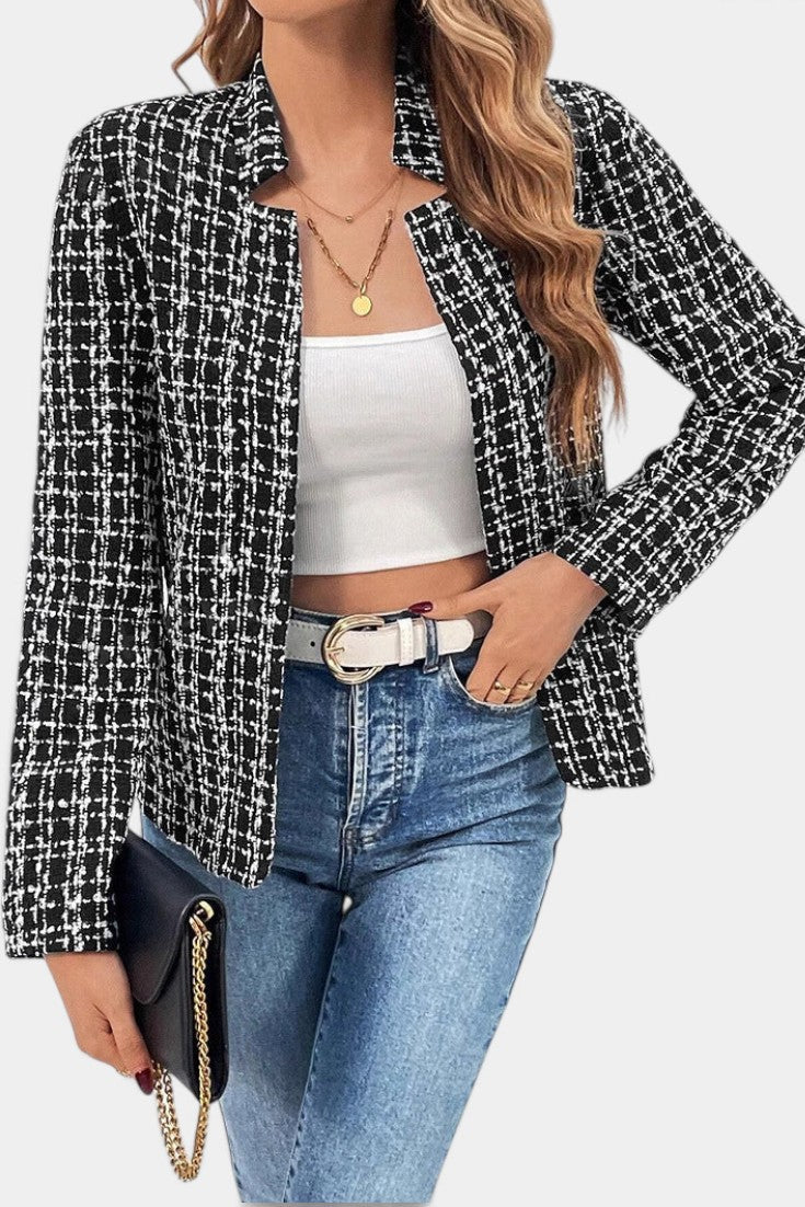Mahaute Visenta short black and white tweed jacket with a structured collar worn over a white top and blue jeans