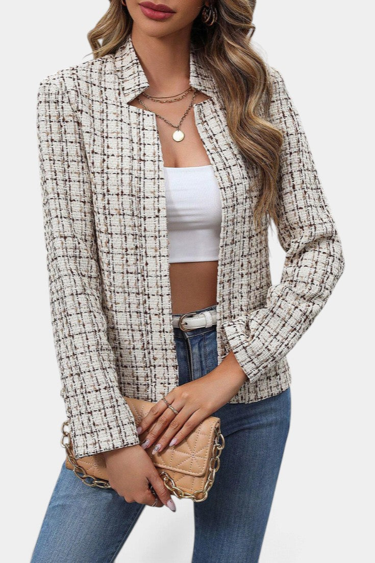 Mahaute Visenta short structured tweed jacket in beige and brown with a shirt collar worn over a white crop top.