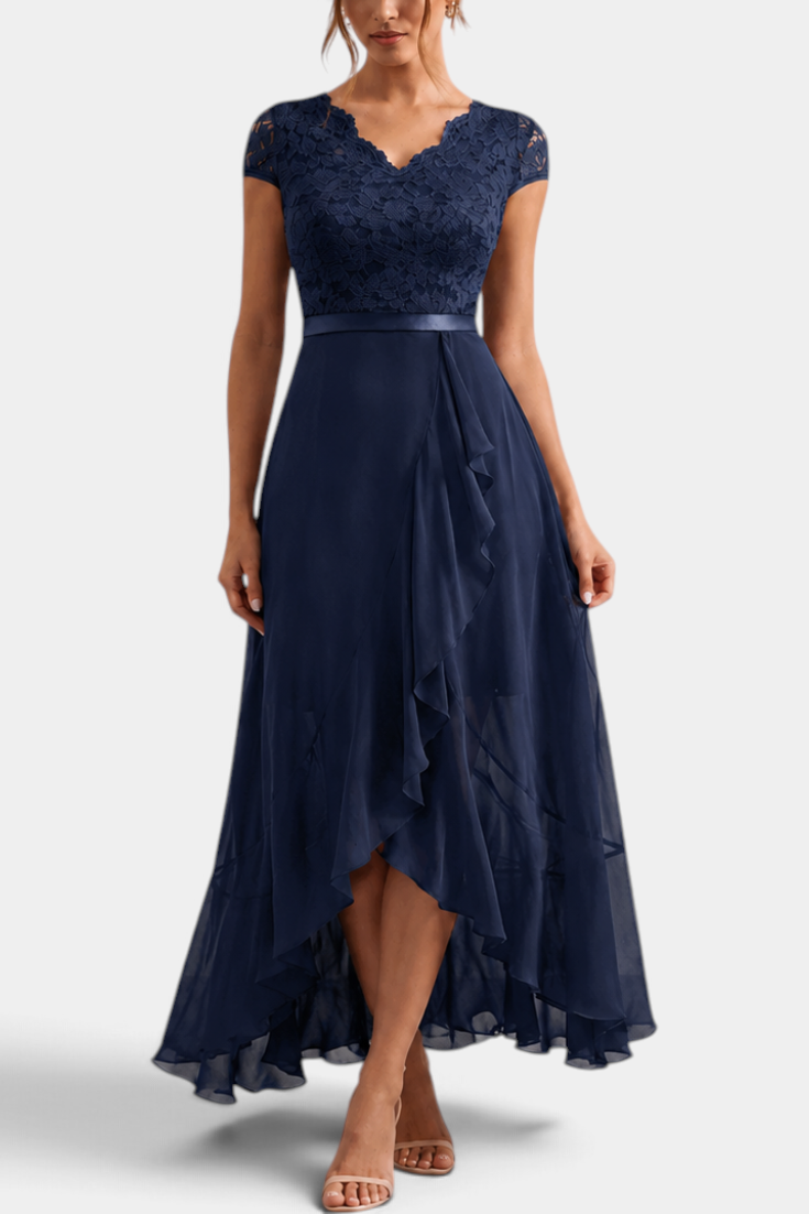 Mahaute Vittoria navy blue floral lace maxi dress with V-neck, short sleeves, and an asymmetrical ruffled skirt.