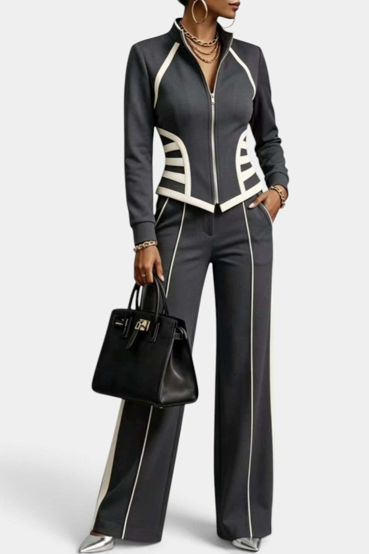 Mahaute Walters charcoal grey zip-up jacket and wide-leg trousers set with white contrast piping and graphic details.