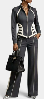 Mahaute Walters charcoal grey zip-up jacket and wide-leg trousers set with white contrast piping and graphic details.