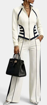 Mahaute Walters cream zip-up jacket and wide-leg trousers set with black contrast piping and trim details.