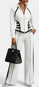 Mahaute Walters white and black zip-up fitted jacket and wide-leg trouser set with graphic contrast detailing.
