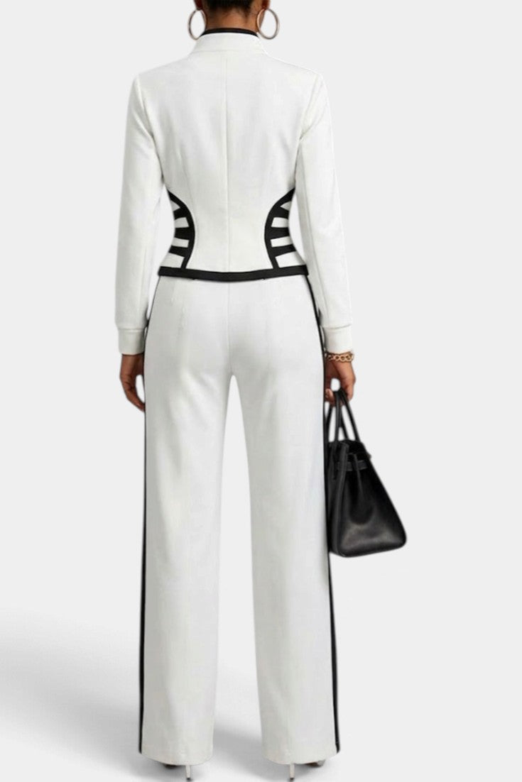 Back view of Mahaute Walters white zip-up jacket and wide-leg trousers set with black graphic contrast detailing.