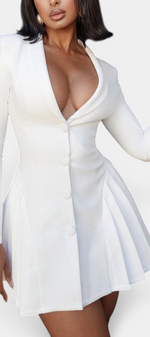 Mahaute white blazer dress with deep V-neck, cinched waist, and pleated skirt, worn by a model.