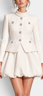 Mahaute cream structured jacket with jewel buttons and matching voluminous bubble skirt on a model