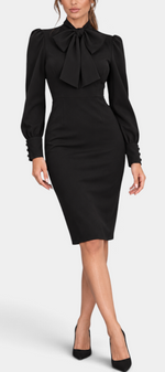 Mahaute Yordanka black midi dress with a pussy-bow collar, long puff sleeves, and buttoned cuffs on a model.