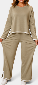 Mahaute Ysella beige knit lounge set with long-sleeve loose top and wide-leg trousers featuring white contrast trim.