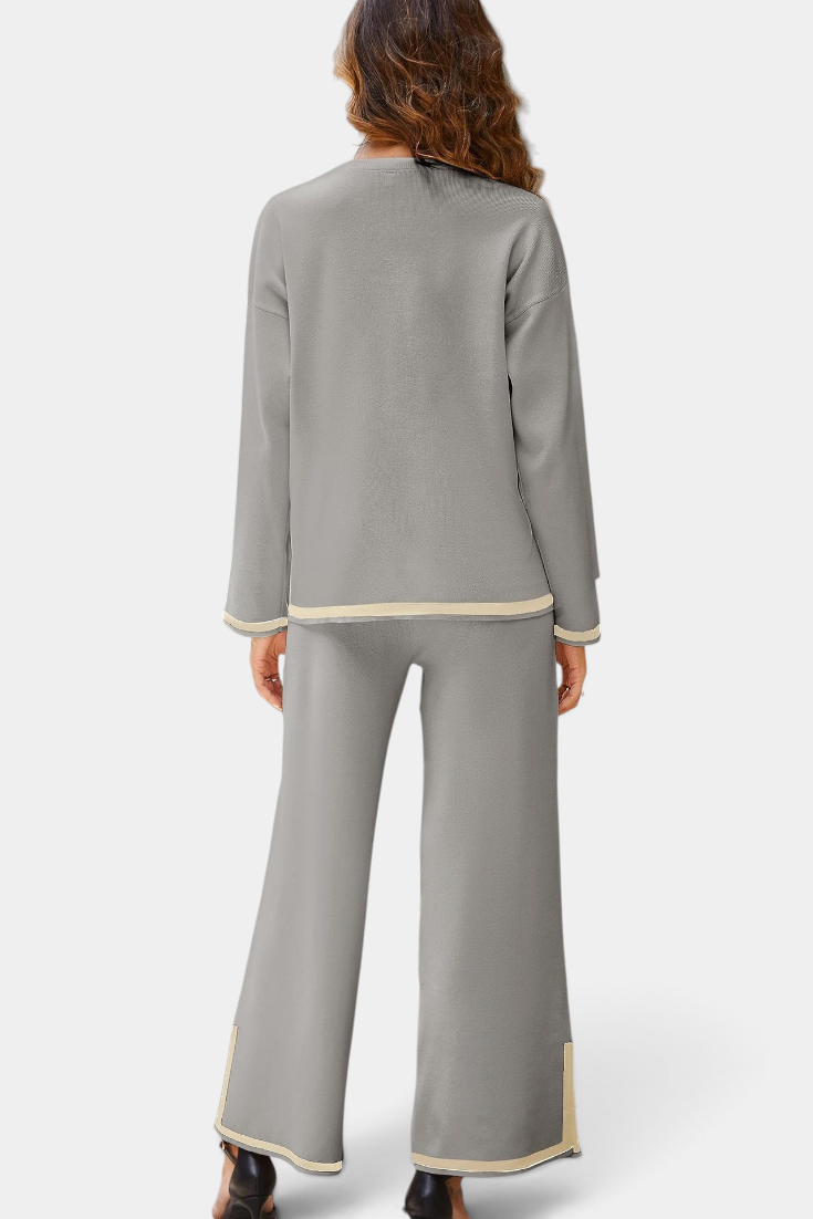 Back view of Mahaute Ysella grey knit lounge set with long sleeve top and wide leg trousers with contrast trim