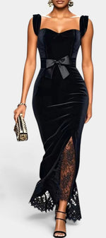 Mahaute Zella long black velvet evening gown with sweetheart neckline, satin waist bow, and lace skirt insert.