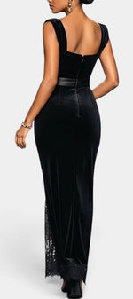 Back view of Mahaute Zella black velvet long dress with lace trim and satin waist detail on a model
