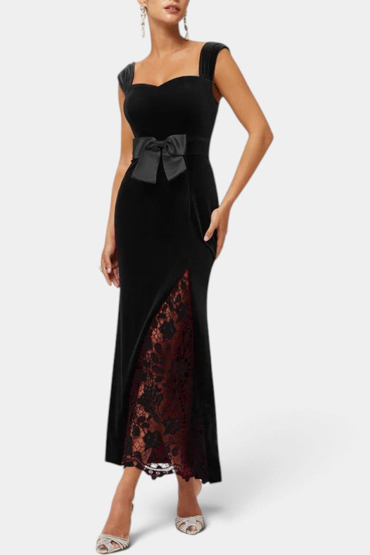 Mahaute Zella long black velvet evening gown with sweetheart neckline, satin waist bow, and red lace skirt panel.