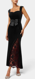 Mahaute Zella long black velvet evening gown with sweetheart neckline, satin waist bow, and red lace skirt panel.
