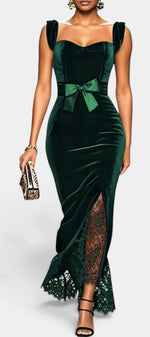 Mahaute Zella long emerald green velvet evening dress with sweetheart neckline, satin bow waist, and lace hem detail.