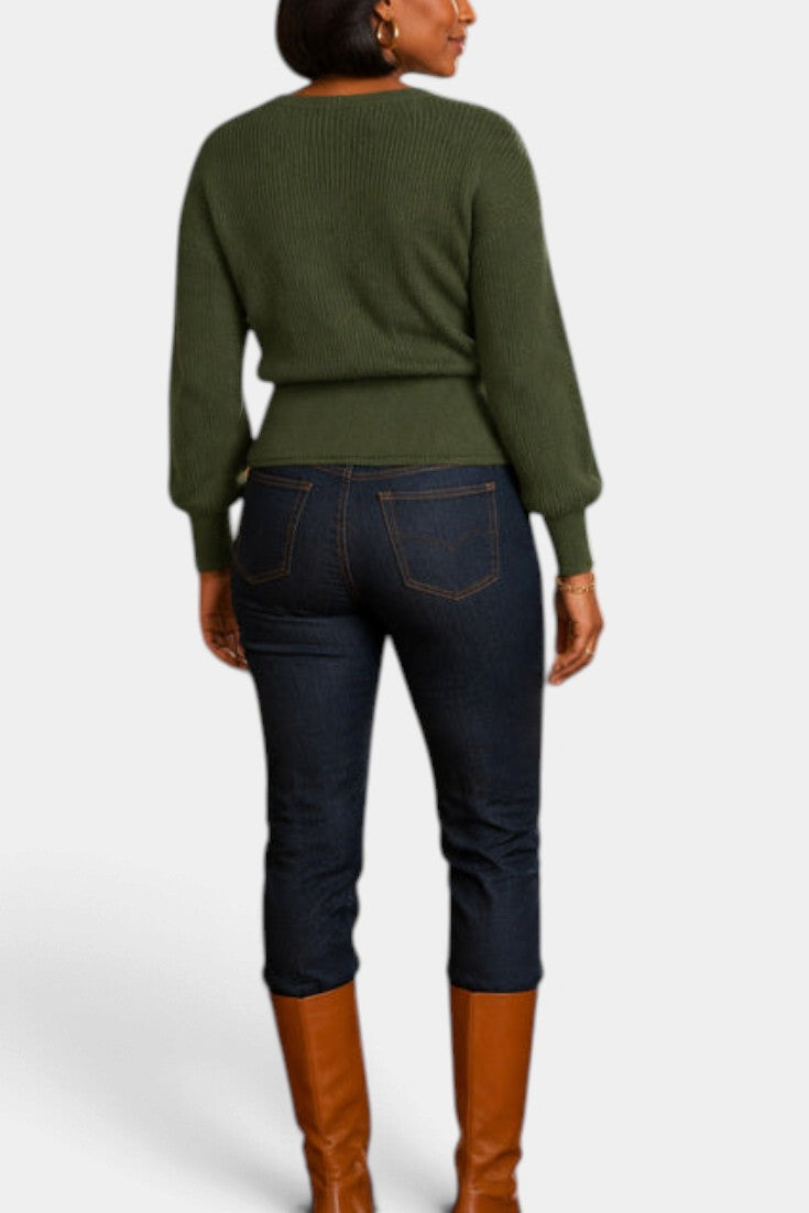 Mahaute Zia olive green knit wrap sweater with long puff sleeves worn with dark denim jeans and brown boots