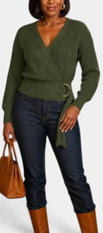Mahaute Zia olive green ribbed knit wrap sweater with V-neck, tie waist, and long sleeves worn with dark jeans.