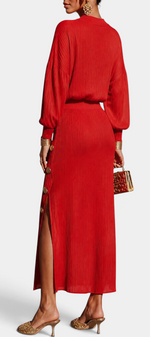 Mahaute Zornitsa red pleated two-piece set featuring a fluid blouse and a long skirt with gold button side slit